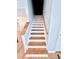 Stairway with wood treads and white risers at 440 Sheppard Xing Ct, Stone Mountain, GA 30083