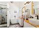 Modern bathroom featuring a soaking tub, walk-in shower, and dual sinks at 1240 Birchwood Ln, Roswell, GA 30076