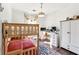 Bright bedroom features a wooden bunk bed, built-in desk, wood floors, and large window at 1240 Birchwood Ln, Roswell, GA 30076
