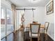 Dining room with modern table, chairs, sliding doors, and stylish barn door leading to living room at 1240 Birchwood Ln, Roswell, GA 30076