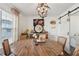Dining room with a round wooden table, chandelier, and decor at 1240 Birchwood Ln, Roswell, GA 30076
