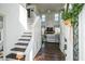 Bright entryway with hardwood floors, staircase and entry to the living room with soaring ceilings at 1240 Birchwood Ln, Roswell, GA 30076