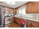 Updated kitchen with granite countertops, stainless steel appliances and wood cabinets at 1240 Birchwood Ln, Roswell, GA 30076