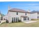 Home's backyard featuring a lawn, patio and view of the house's rear exterior at 2036 Broadmoor Way, Fairburn, GA 30213