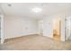 Spacious bedroom featuring neutral carpeting and a walk-in closet at 2036 Broadmoor Way, Fairburn, GA 30213