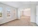 Bright bedroom with neutral walls and carpet, offering ample natural light through a window at 2036 Broadmoor Way, Fairburn, GA 30213