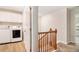 Functional laundry room with modern washer and dryer, storage cabinets, and easy access to staircase at 2036 Broadmoor Way, Fairburn, GA 30213