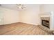 Spacious living room featuring a classic brick fireplace and neutral color scheme for a cozy atmosphere at 2036 Broadmoor Way, Fairburn, GA 30213