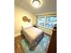 Bedroom with neutral walls, wood-look floors, and a bed in front of a window with natural light at 5440 Portside Dr, Acworth, GA 30101