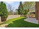 A beautifully landscaped backyard includes manicured artificial turf, an upper deck and a privacy fence at 1662 Hartford Ne Gln, Atlanta, GA 30319
