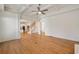Spacious living room with hardwood floors, coffered ceiling, and open layout to kitchen at 1662 Hartford Ne Gln, Atlanta, GA 30319
