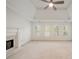 Bright living room boasts a fireplace, a ceiling fan and three sunny windows at 1662 Hartford Ne Gln, Atlanta, GA 30319