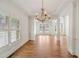 Spacious living room showcasing hardwood floors, white trim, and elegant chandelier at 1662 Hartford Ne Gln, Atlanta, GA 30319
