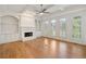 Bright and open living room featuring built-in shelving, fireplace, and coffered ceiling at 1662 Hartford Ne Gln, Atlanta, GA 30319