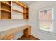 Bright home office area with built-in shelving and a window with natural light at 1662 Hartford Ne Gln, Atlanta, GA 30319