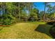 Expansive green backyard with well maintained lawn, mature trees, and a gazebo at 2972 Ponderosa Cir, Decatur, GA 30033