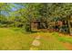 Gazebo with a backyard playset surrounded by verdant landscaping, providing a serene and playful outdoor space at 2972 Ponderosa Cir, Decatur, GA 30033