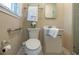 Neutral bathroom featuring a toilet, sink, medicine cabinet, towel rack and accessible grab bar at 2972 Ponderosa Cir, Decatur, GA 30033