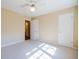 Bright bedroom showcasing neutral walls, carpet, closet space, and an ensuite bathroom at 2972 Ponderosa Cir, Decatur, GA 30033