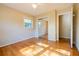 Bright bedroom with hardwood floors, ceiling fan, and large mirrored closet at 2972 Ponderosa Cir, Decatur, GA 30033