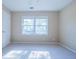 Bright bedroom featuring neutral walls, carpet, a double window, and a spacious closet at 2972 Ponderosa Cir, Decatur, GA 30033