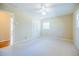 Bedroom with carpet, natural light, neutral walls, and access to other rooms at 2972 Ponderosa Cir, Decatur, GA 30033