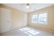 Bright bedroom showcasing neutral walls, carpet, a double window, and a ceiling fan at 2972 Ponderosa Cir, Decatur, GA 30033
