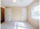 Bright bedroom showcasing neutral walls, carpet, a double window, closet space, and ceiling fan at 2972 Ponderosa Cir, Decatur, GA 30033