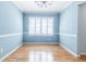 Traditional dining room boasts hardwood floors, chandelier, and wainscoting with blue walls at 2972 Ponderosa Cir, Decatur, GA 30033