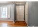Bright foyer with hardwood floors, white door, and neutral wall colors at 2972 Ponderosa Cir, Decatur, GA 30033