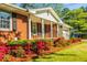 Beautiful brick home with a covered front porch and manicured flower beds at 2972 Ponderosa Cir, Decatur, GA 30033
