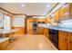 Kitchen with wood cabinets, double oven, and eating area, adjacent to doorway at 2972 Ponderosa Cir, Decatur, GA 30033