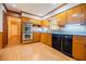 Traditional kitchen featuring wood cabinets, stainless appliances, and tile backsplash at 2972 Ponderosa Cir, Decatur, GA 30033