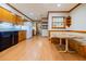 Eat-in kitchen with breakfast nook, laminate floors, wood cabinets, and black appliances at 2972 Ponderosa Cir, Decatur, GA 30033