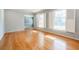 Empty living room with hardwood floors, natural light, and view to dining room at 2972 Ponderosa Cir, Decatur, GA 30033