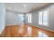 Spacious living room with hardwood floors, plantation shutters, and chandelier lighting at 2972 Ponderosa Cir, Decatur, GA 30033