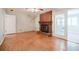 Bright living room with brick fireplace, ceiling fan, and access to sunroom at 2972 Ponderosa Cir, Decatur, GA 30033