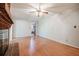 Living room with wood floor and brick fireplace featuring a view of the bathroom at 2972 Ponderosa Cir, Decatur, GA 30033