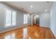 Bright living room with hardwood floors, white trim, blue accent walls, and large windows with plantation shutters at 2972 Ponderosa Cir, Decatur, GA 30033