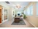 Bright home office with neutral carpet, ceiling fan, built-in desk, and lots of natural light from multiple windows at 2972 Ponderosa Cir, Decatur, GA 30033