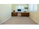 Home office space with built-in wooden desk and storage at 2972 Ponderosa Cir, Decatur, GA 30033