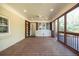Large screened-in porch with wood flooring, and access to an adjacent outdoor deck space at 2972 Ponderosa Cir, Decatur, GA 30033