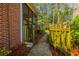 Fenced side yard with access to a screened-in porch and mature landscaping at 2972 Ponderosa Cir, Decatur, GA 30033