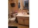 Bathroom features a white vanity with storage, mirror and toilet with shelving at 3346 Northcrest Rd # A, Atlanta, GA 30340