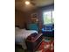 A view of the bedroom with a large window with natural light at 3346 Northcrest Rd # A, Atlanta, GA 30340