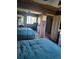 Spacious bedroom with blue comforters and a mirrored closet at 3346 Northcrest Rd # A, Atlanta, GA 30340