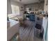 The grey kitchen features wood-look flooring, stainless appliances, a dining area, and good natural light at 3346 Northcrest Rd # A, Atlanta, GA 30340