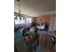 Living room with dining table and large windows providing natural light at 3346 Northcrest Rd # A, Atlanta, GA 30340
