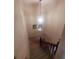 A stairway with wooden railing leading to the lower level of the home at 3346 Northcrest Rd # A, Atlanta, GA 30340