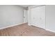 Bedroom featuring wood-look floors, neutral walls, and a double-door closet at 1232 Andrews Dr, Marietta, GA 30062
